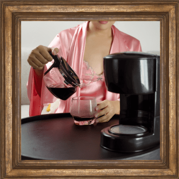 woman serving from an automatic drip coffee maker